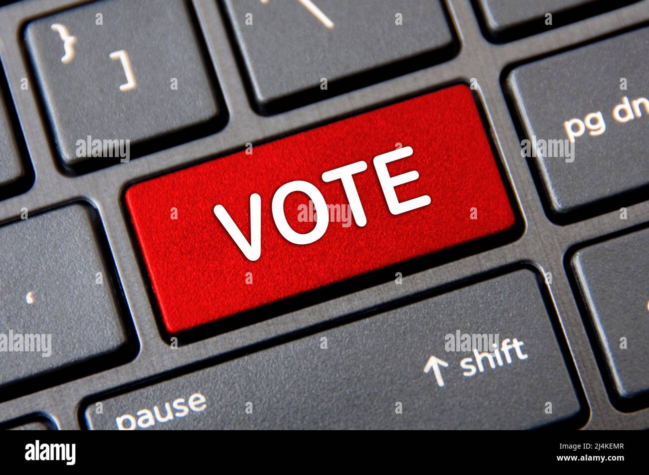 Online voting concept - Laptop keyboard with red Vote button Stock ...