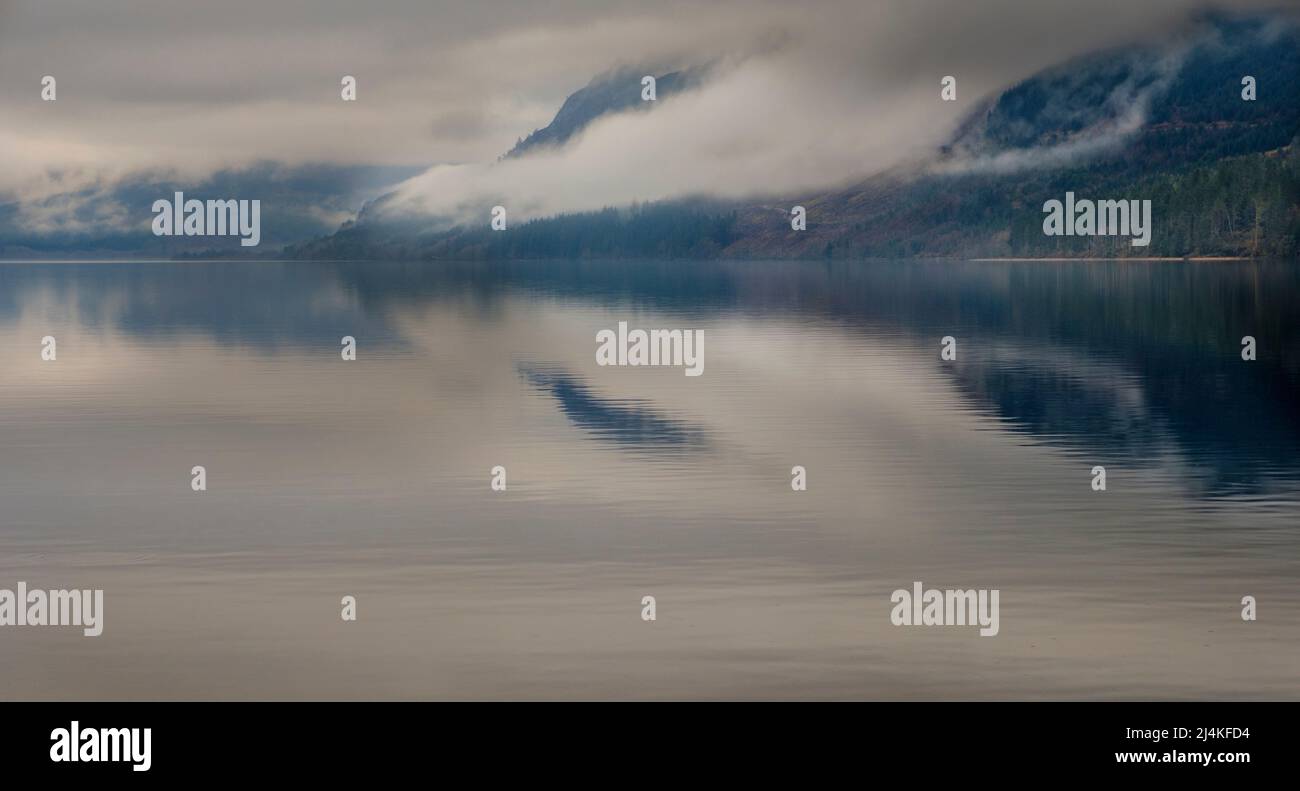 Looking across Loch Lochy, highlands of Scotland in a misty spring morning Stock Photo