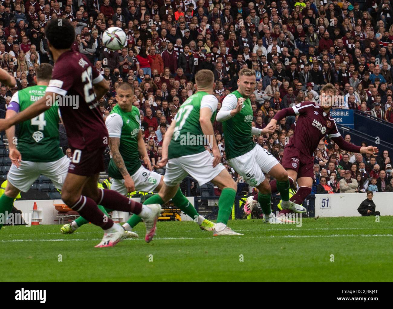 Glasgow, UK. 16th Apr, 2022. Scottish Cup Semi-Final - Heart of Midlothian FC v Hibernian FC 16/04/2022 Pic shows: Hearts' left-back, Stephen Kingsley, fires home what proved to be the winning goal as Hearts take on Hibs in the Scottish Cup semi final at Hampden Park, Glasgow Credit: Ian Jacobs/Alamy Live News Stock Photo