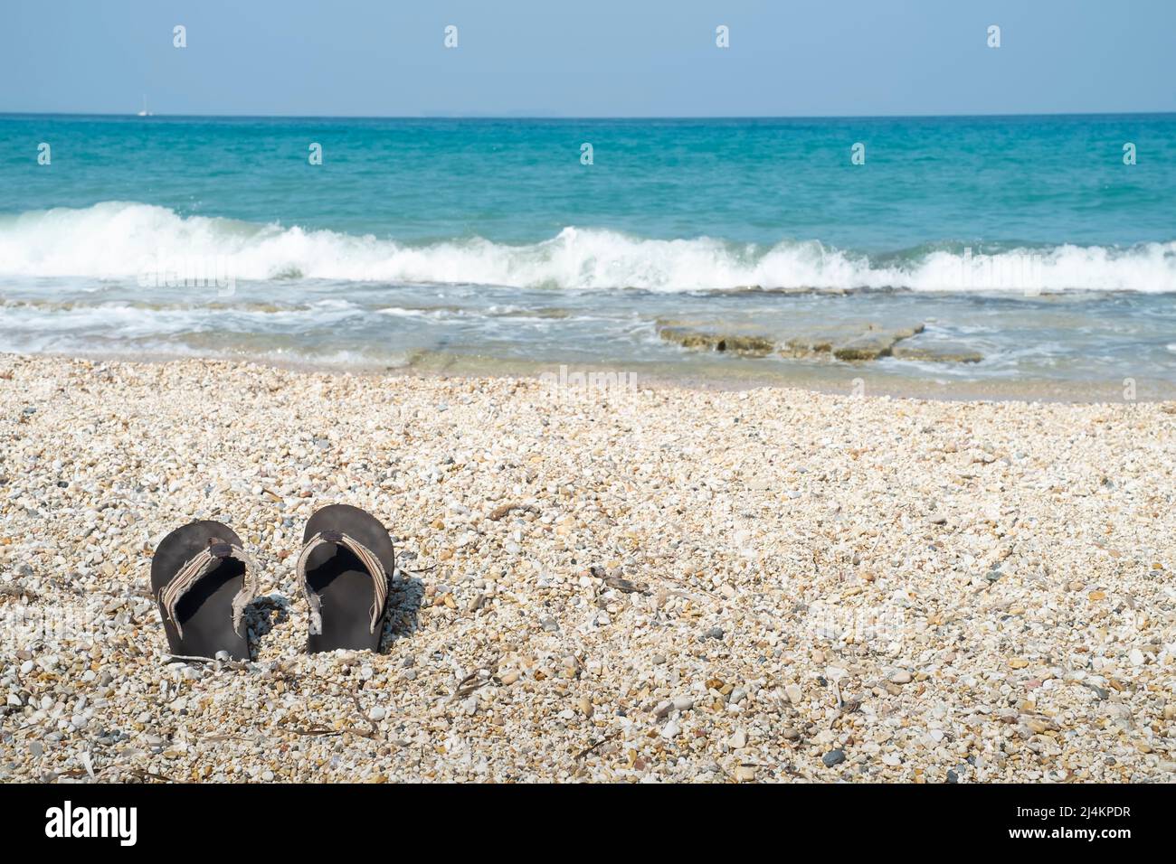 Flip flops on the beach Stock Photo - Alamy