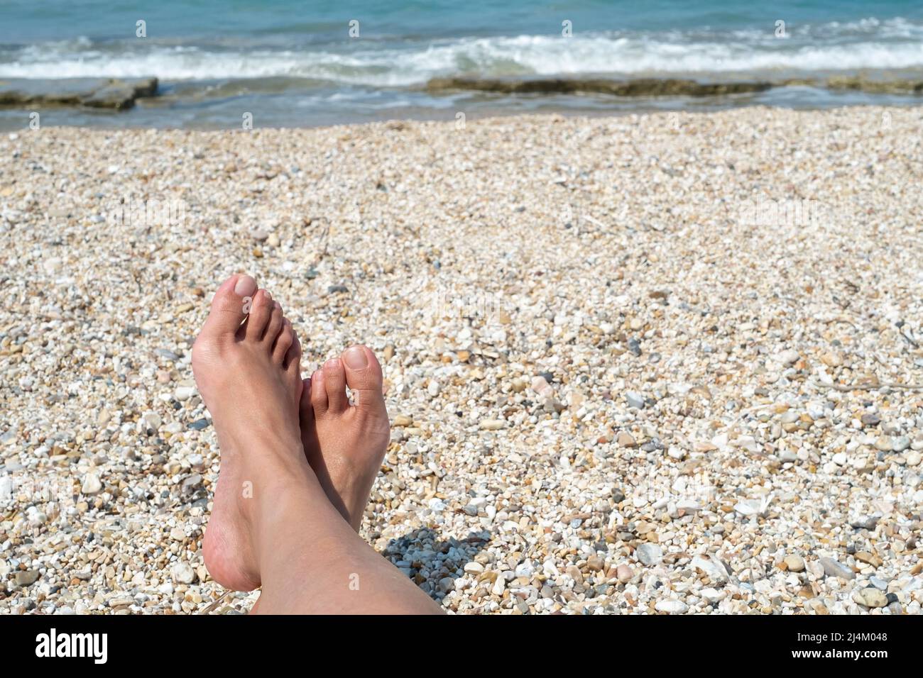 Female feet on the beach Stock Photo Alamy