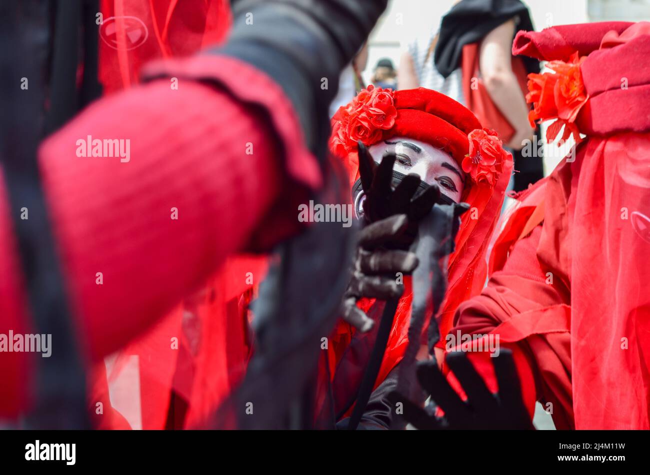 Activists of the Extinction Rebellion group wearing all red to alert ...