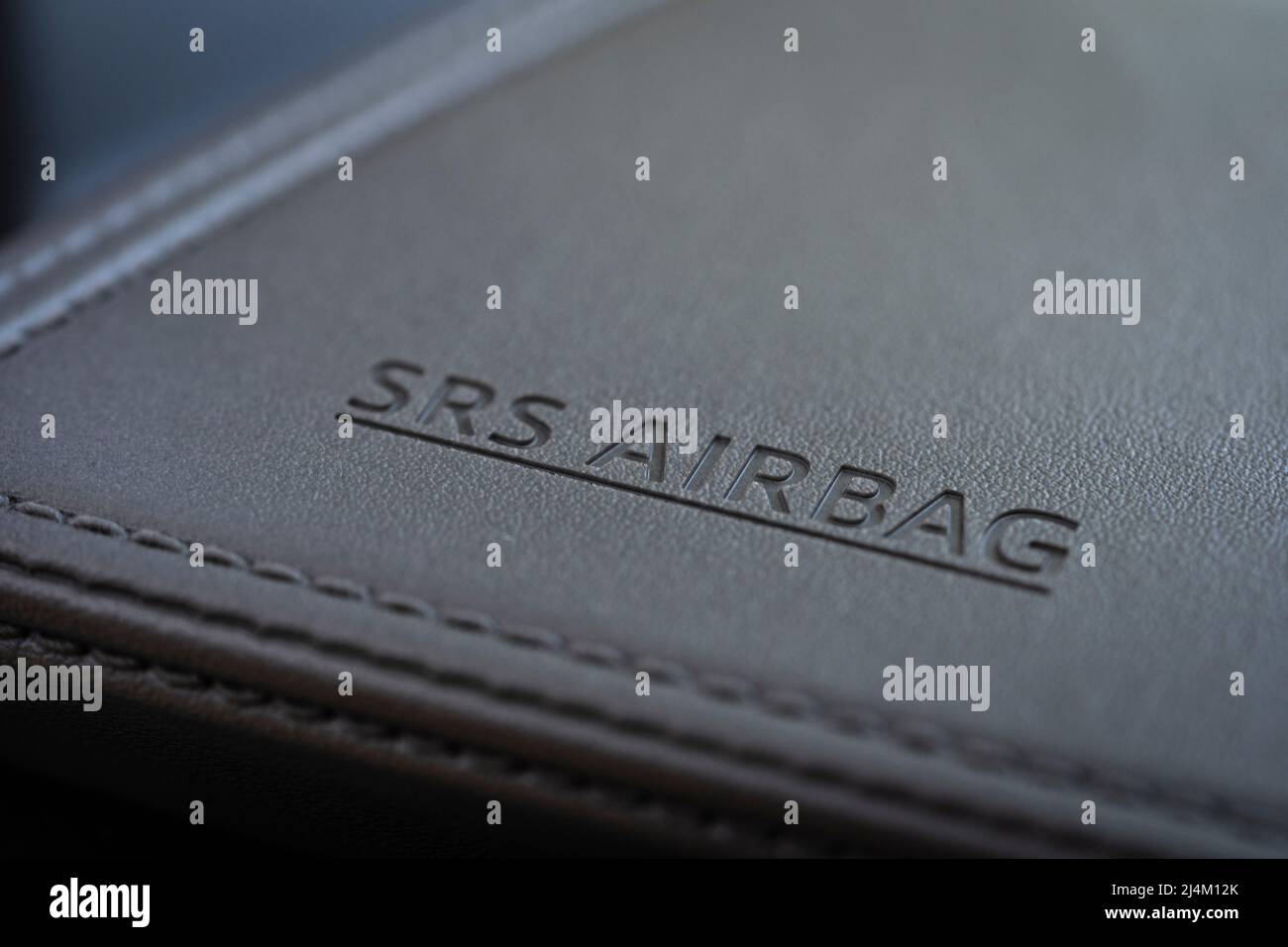 Closeup on the lettering SRS (Supplementary Restraint System) Airbag, meaning an air bag that supplements a seat belt. Passenger side Toyota CH-R. UK Stock Photo