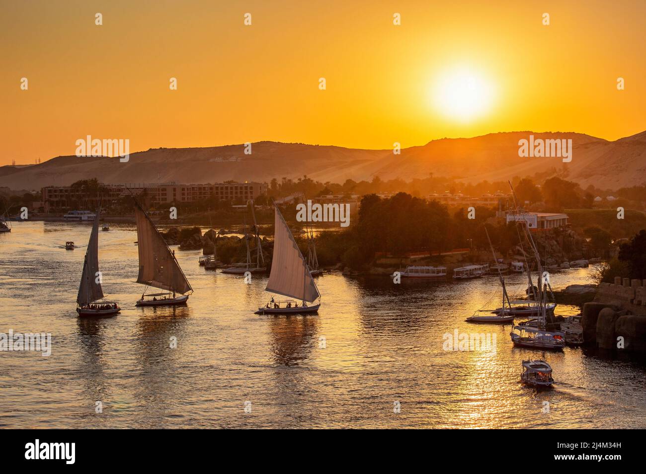 felucca boats on Nile river at sunset Stock Photo