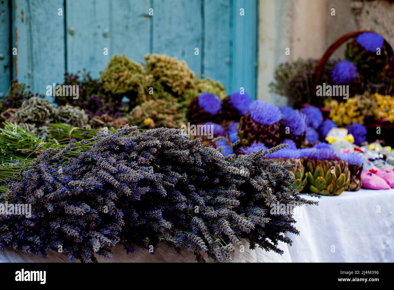 Fragrant sachets and potpourri bags in baskets and on table tops at an outdoor flea market in Alaçati, Turkey. Stock Photo