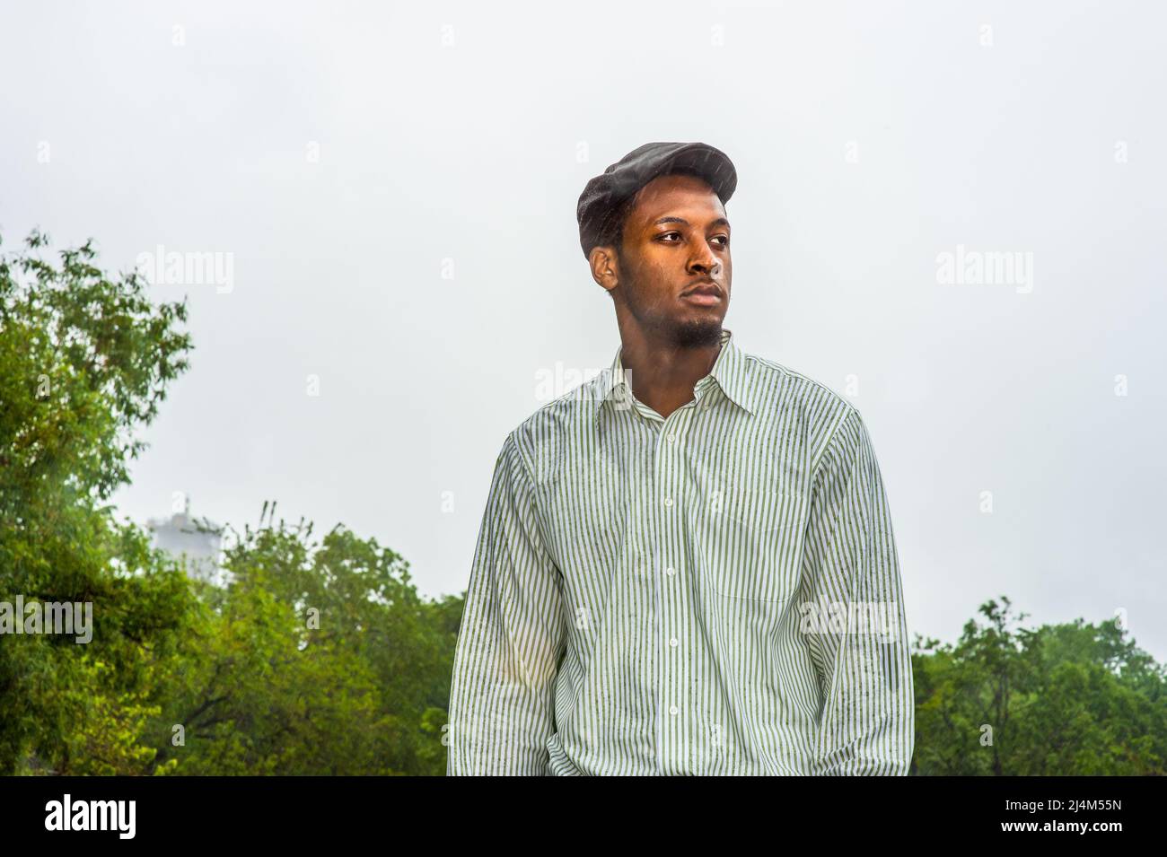 In the rain, a foggy, wet , blur feel. Wearing a waterproof jacket, a ...
