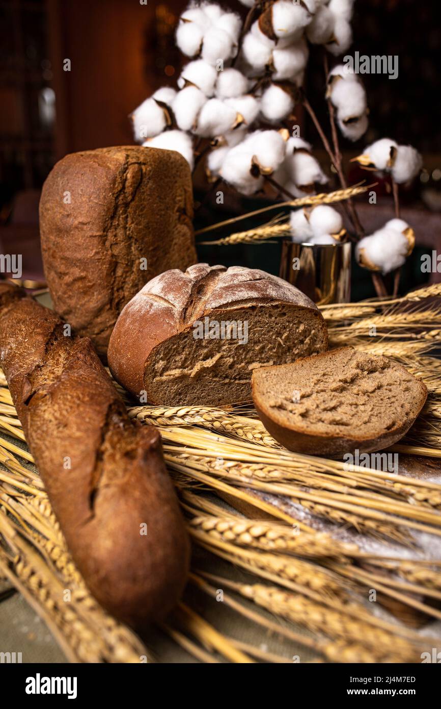 Different types of bread on a wooden background. Bakery products Stock Photo