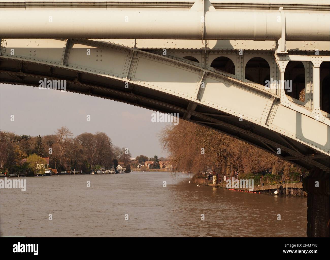 A view from a river cruiser, going under Kingston upon Thames  railway bridge over the river Thames, London, England Stock Photo