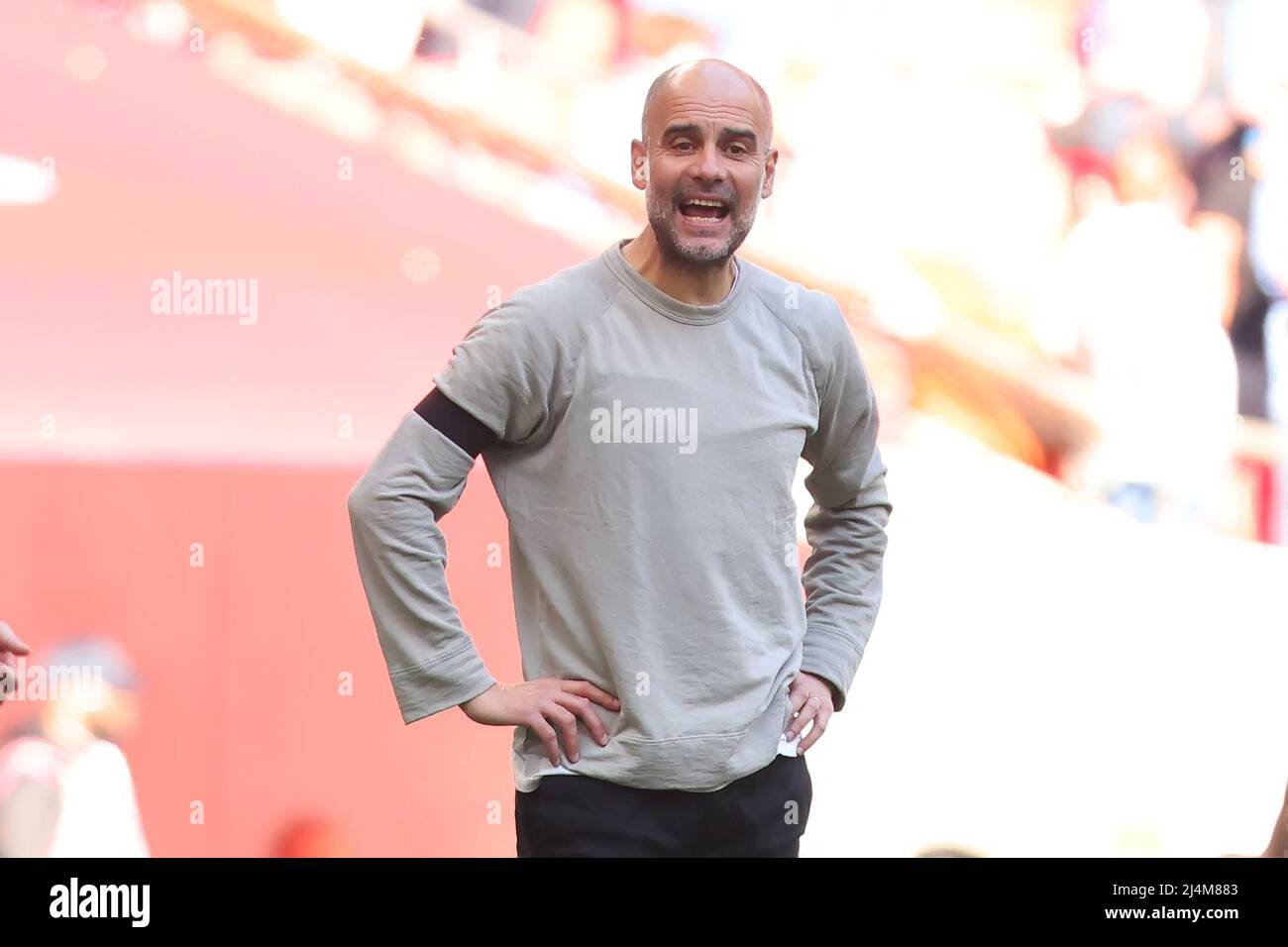 16th April 2022, Wembley Stadium, London England: FA Cup semi-final, Liverpool versus Manchester City: Manchester City Manager Josep Guardiola looks confused at his teams play Stock Photo