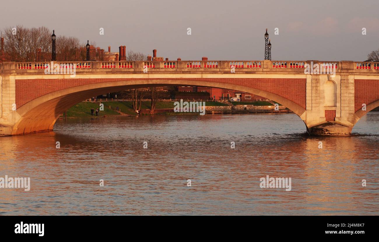 Hampton Court bridge over the River Thames, in evening, spring sunshine Stock Photo