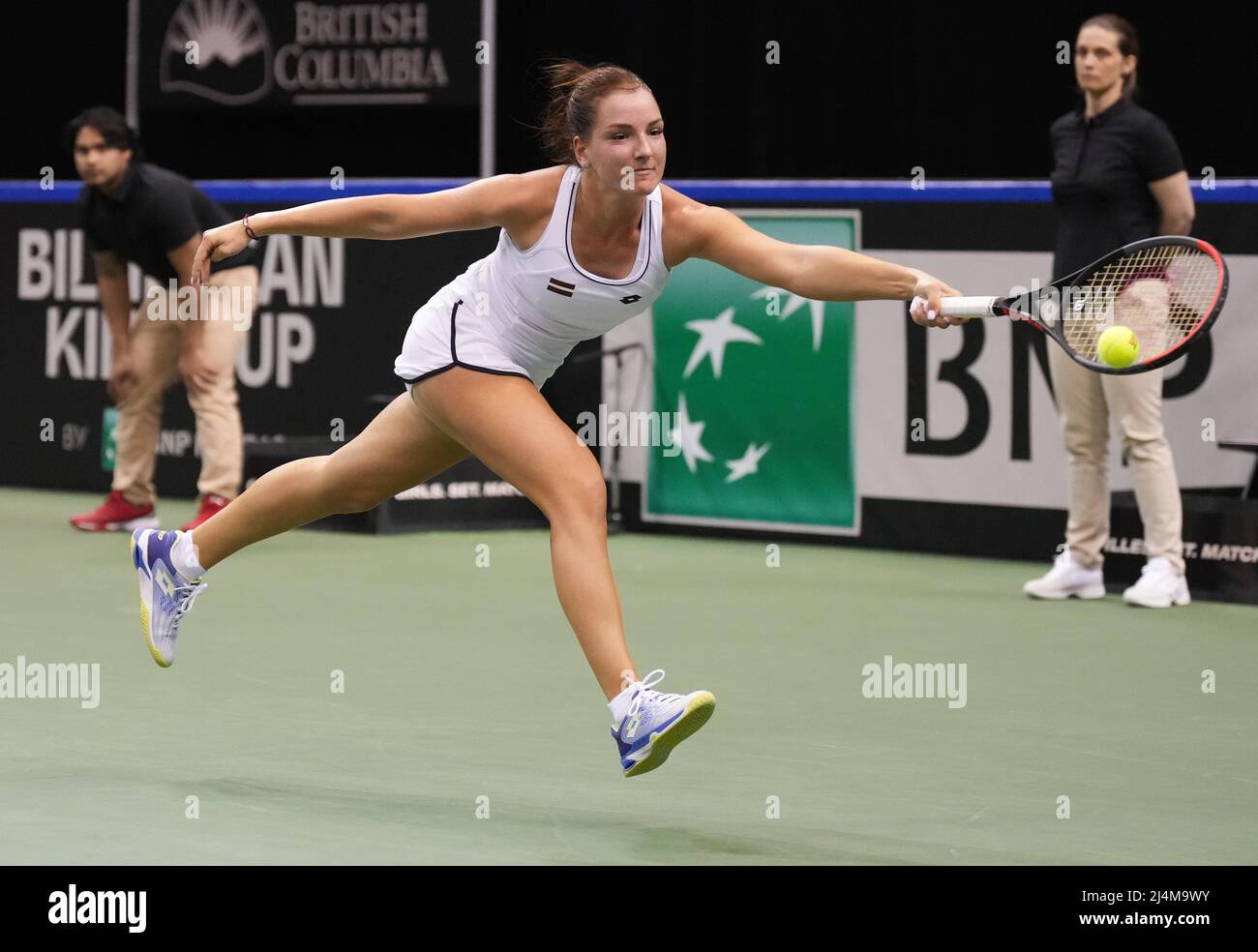 April 15, 2022, VANCOUVER, BC, CANADA: Latvia's Darja Semenistaja leaps but  fails to reach the ball during a Billie Jean King Cup qualifier singles  tennis match against Canada's Leylah Annie Fernandez, in