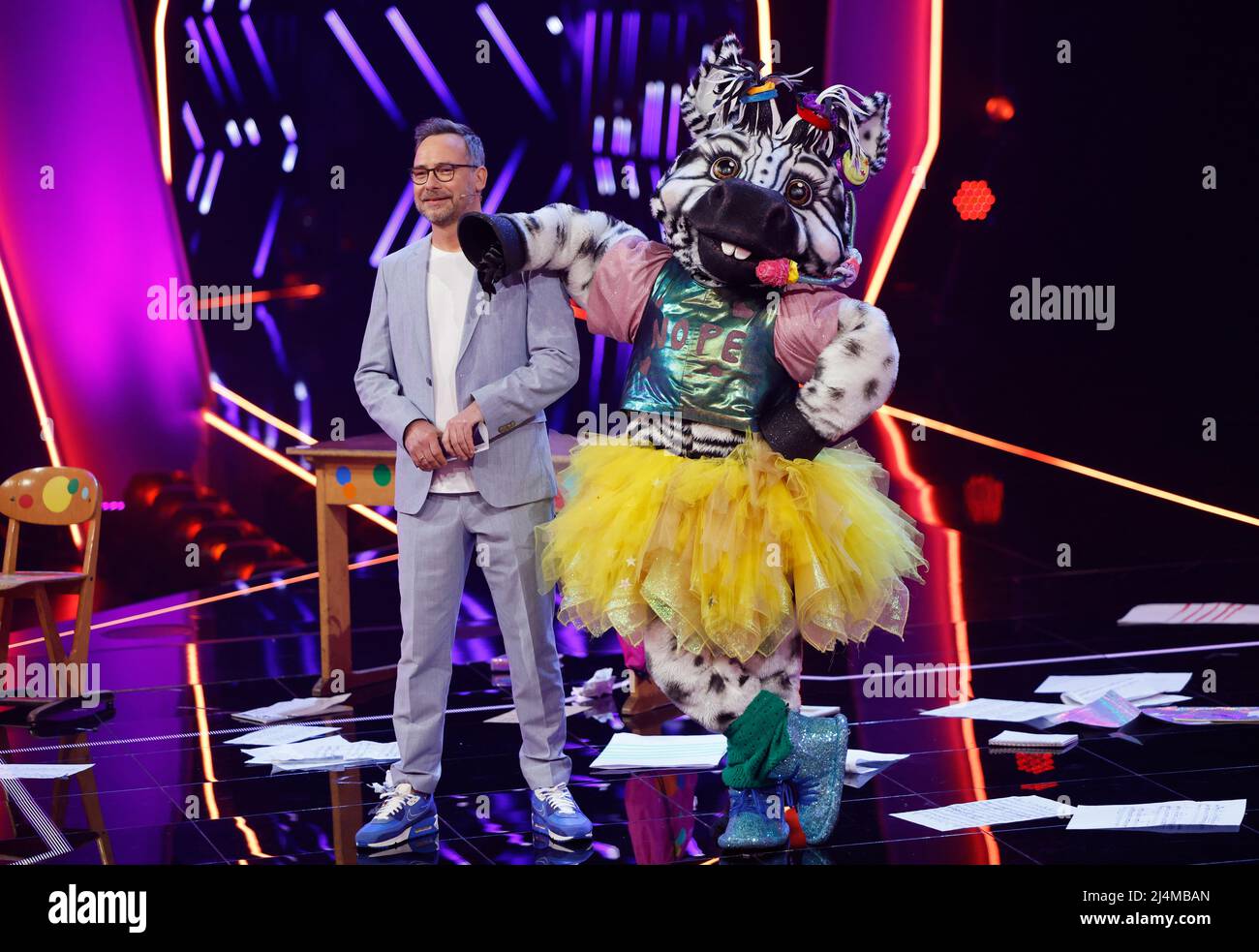 Cologne, Germany. 16th Apr, 2022. The character "The Zebra" is on stage in the  ProSieben show "The Masked Singer" alongside host Matthias Opdenhövel.  Credit: Thomas Banneyer/dpa/Alamy Live News Stock Photo - Alamy