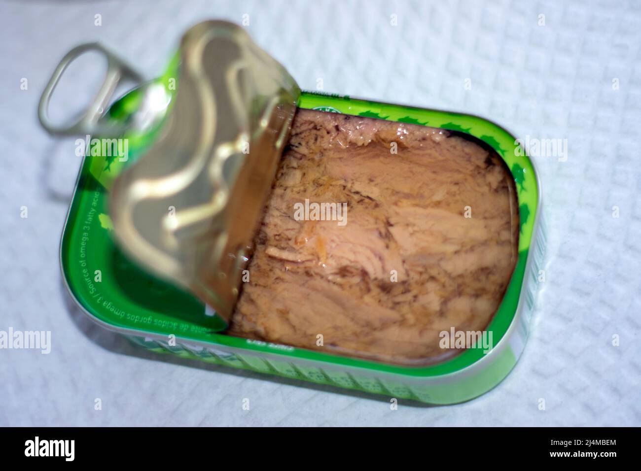 Open tuna can, wartime food, food with a lot of shelf life to consume. healty food. Atum or Tuna. Metal package. Stock Photo