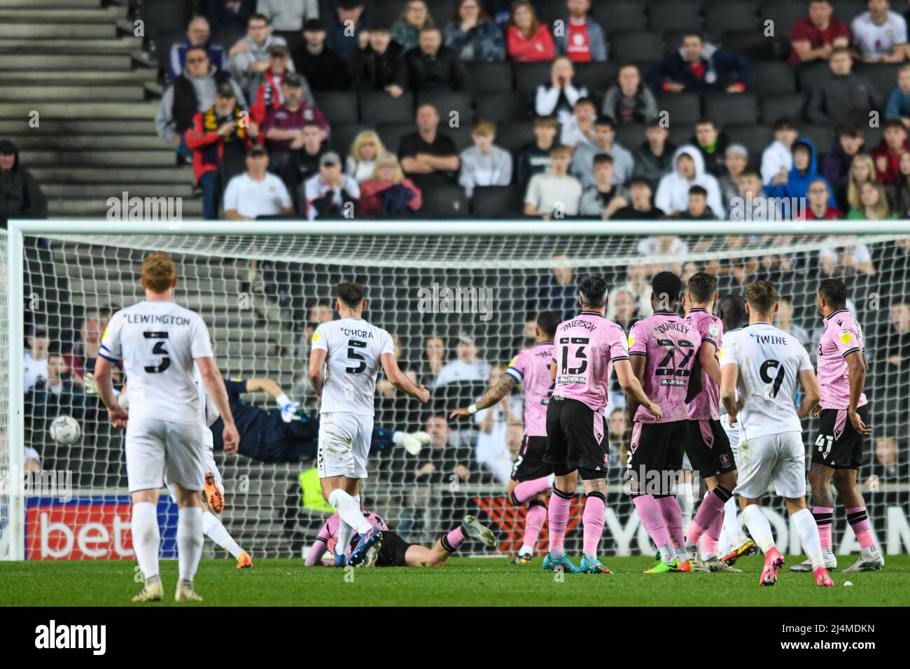 Milton Keynes, UK. 16th Apr, 2022. Scott Twine #9 of Milton Keynes Dons scores a goal to make it 2-3 in Milton Keynes, United Kingdom on 4/16/2022. (Photo by Simon Whitehead/News Images/Sipa USA) Credit: Sipa USA/Alamy Live News Stock Photo