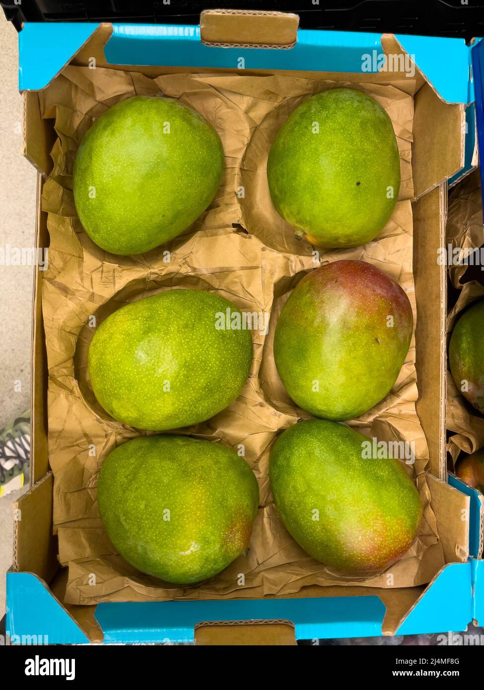 Healthy mango on display in a retail store Stock Photo Alamy