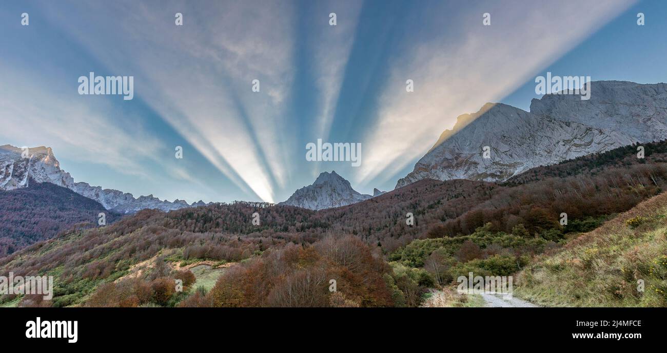 Sunbeams over Le Dec de Lhurs peak, Lescun circus, french pyrenees Stock Photo