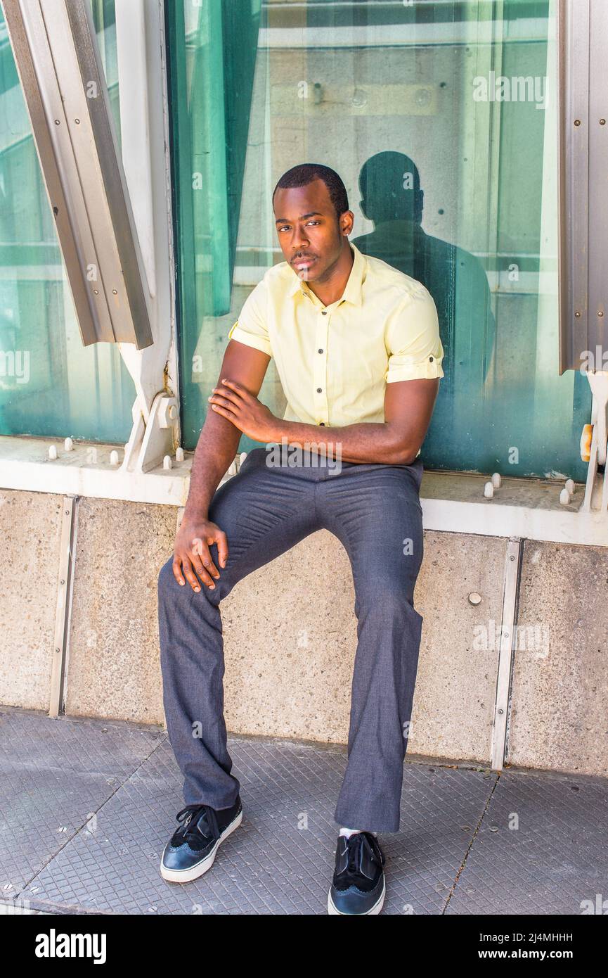 Dressing in a light yellow shirt, gray 