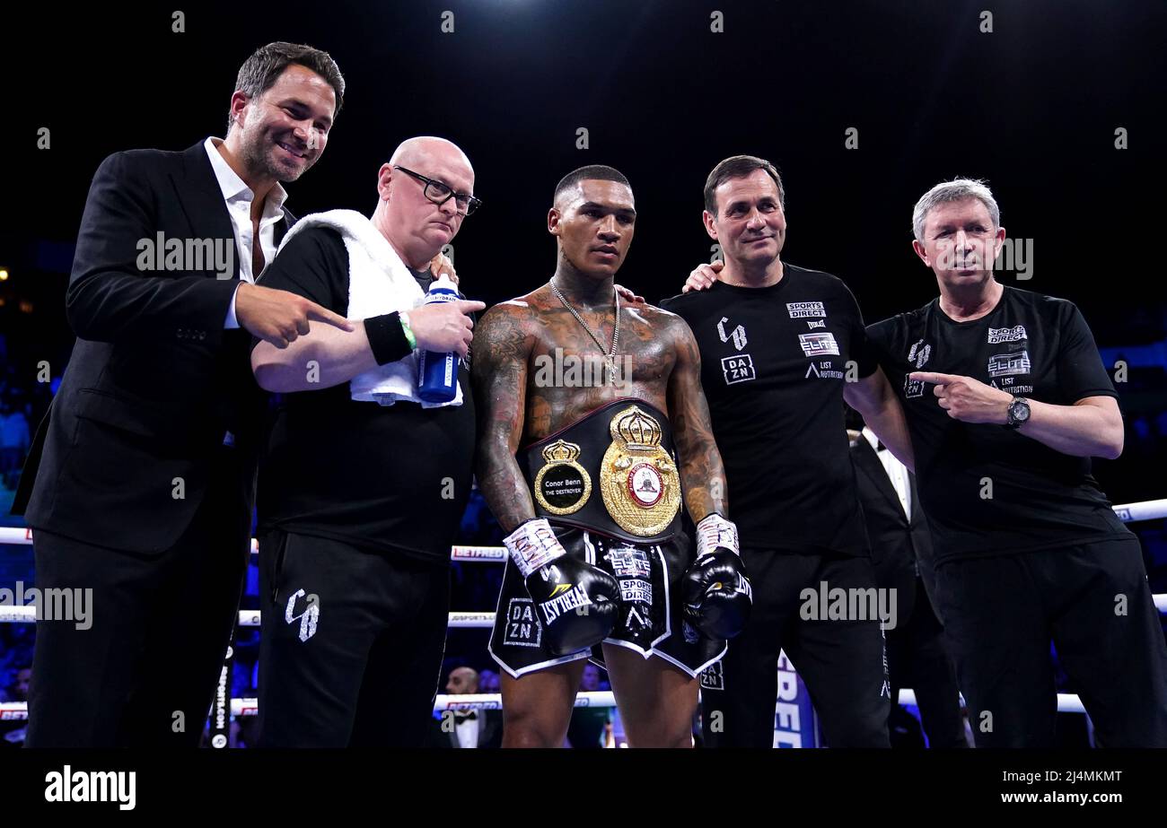 Conor Benn (centre), trainer Tony Sims (second right) and promotor Eddie Hearn after victory against Chris van Heerden in the World Boxing Association Continental Welter Title bout at the AO Arena, Manchester. Picture date: Saturday April 16, 2022. Stock Photo