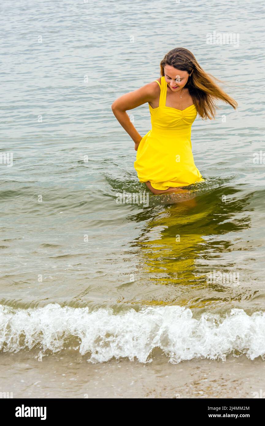 Woman in dress wading in water hi-res stock photography and images - Alamy