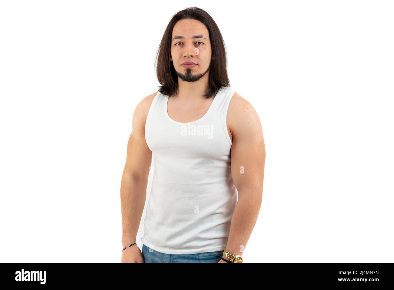 Medium shot of young long-haired, bearded Caucasian man standing, putting his arms down white background isolated copy space studio shot . High quality photo Stock Photo