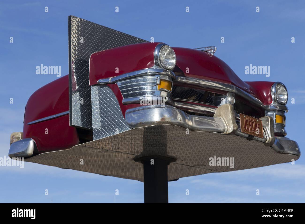 Front Side View of Classic Red Vintage Chevrolet Model Car or Chevy American Vehicle from 1950s on Elevated Platform in City of Jerome, Arizona Stock Photo