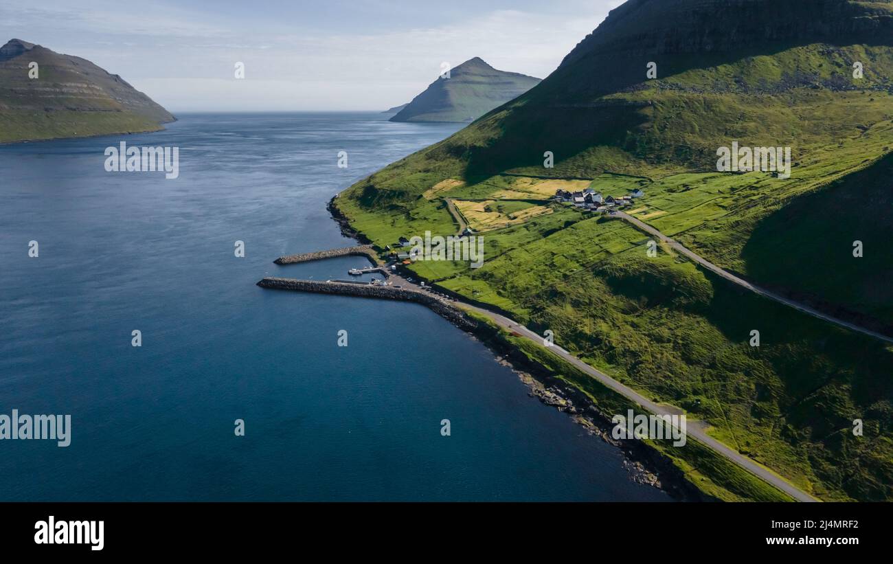 Beautiful aerial view of Sydradalur port and village near the Seal woman statue in the Faroe Islands Stock Photo