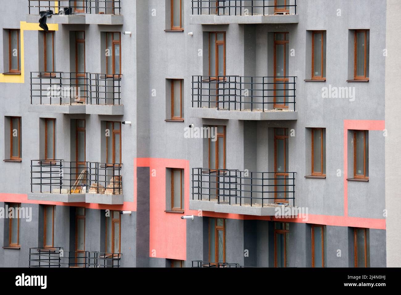 Architectural details of modern high apartment building facade with ...