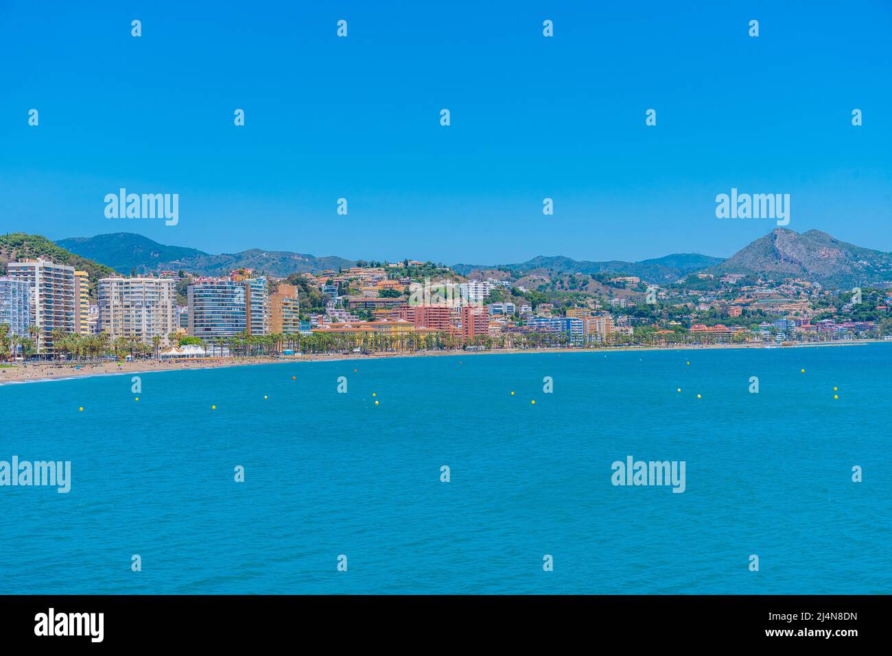 People Are Enjoying A Sunny Day On Malagueta Beach In Malaga Spain People Are Enjoying A Sunny Day On Malagueta Beach In Malaga Spain