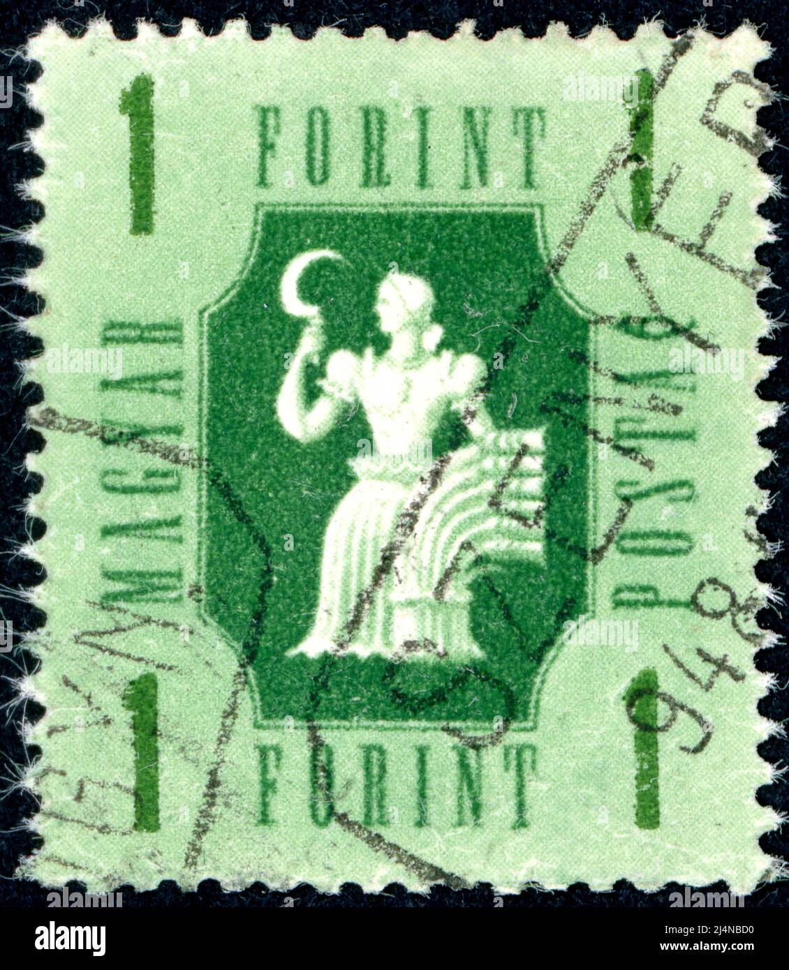 HUNGARY - CIRCA 1946: A stamp printed in Hungary, depicts a woman with a sickle, the symbol of agriculture, circa 1946 Stock Photo