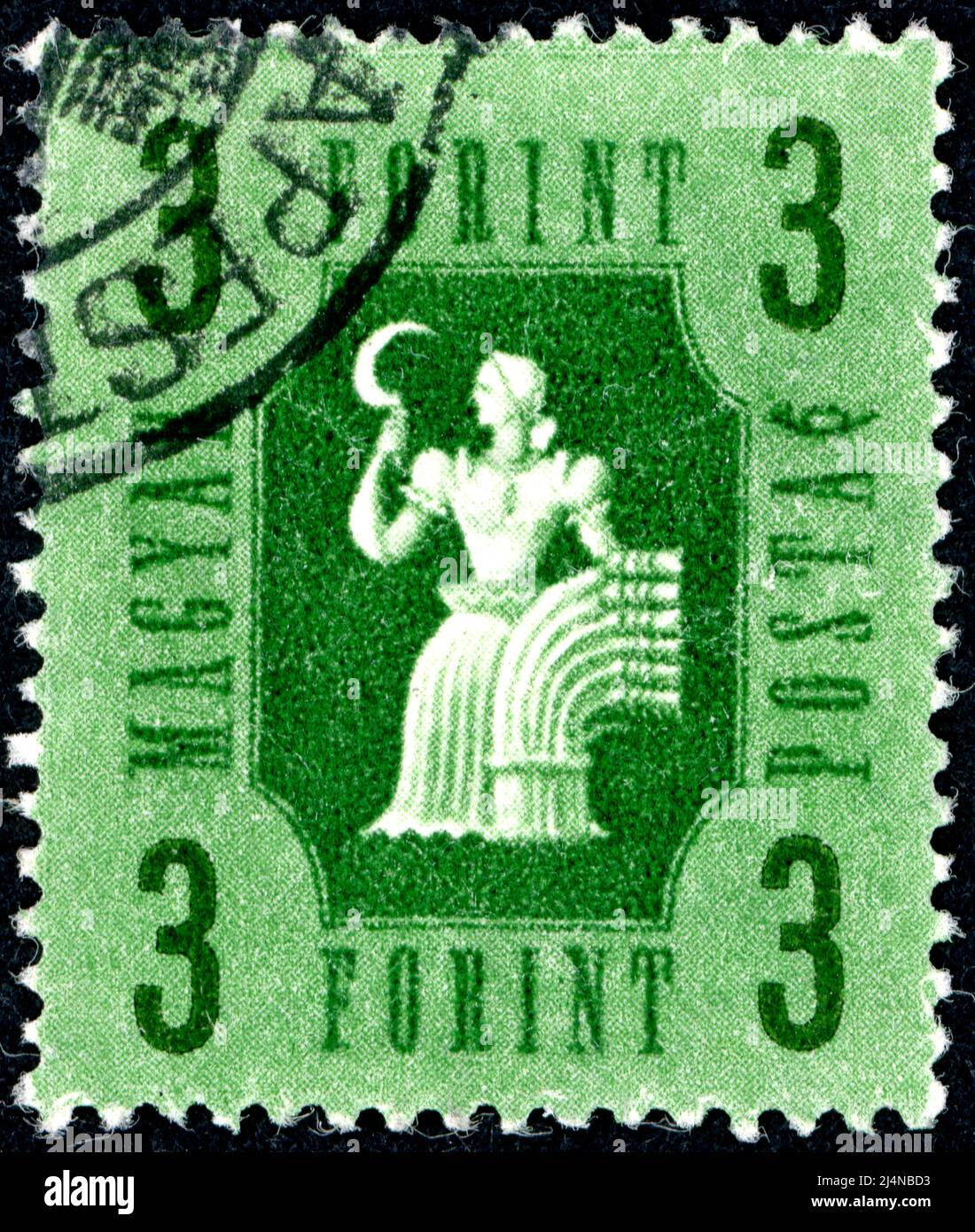 HUNGARY - CIRCA 1946: A stamp printed in Hungary, depicts a woman with a sickle, the symbol of agriculture, circa 1946 Stock Photo