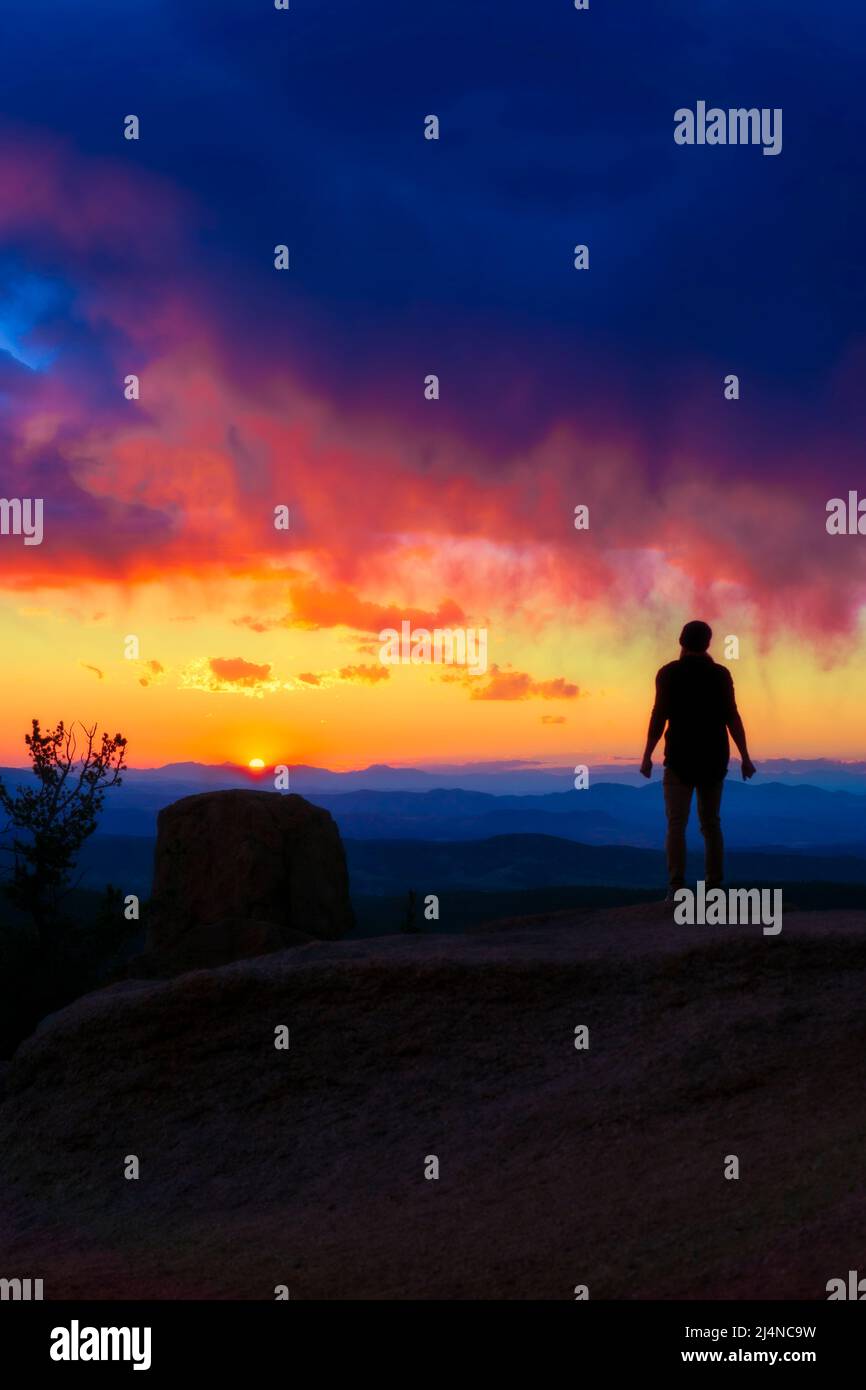 Person Silhouette Watching Stunning Sunset Sunrise On Scenic View Stock Photo