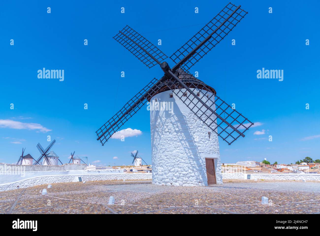 White windmills at Campo de Criptana in Spain Stock Photo