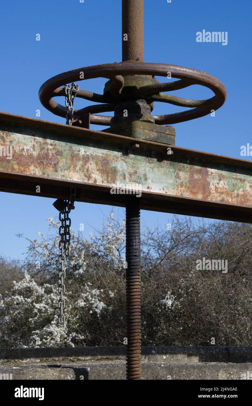 Old, rusty, metal wheel and girder Stock Photo