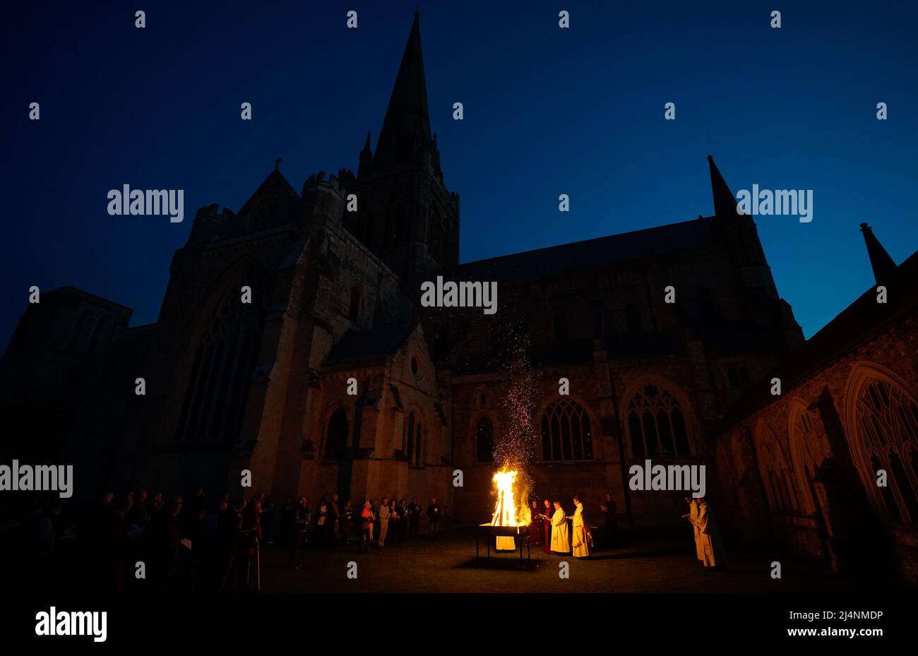 People take part in a Dawn Liturgy of Easter service at Chichester Cathedral prior to the Paschal candle being lit. Picture date: Sunday April 17, 2022. Stock Photo
