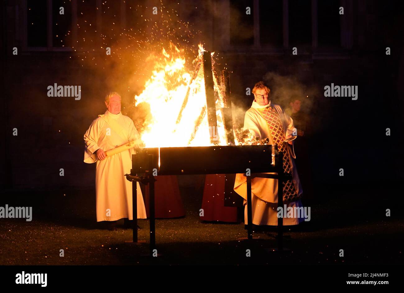 The Very Reverend Stephen Waine, Dean of Chichester Cathedral (right) during the lighting of the Paschal candle during a Dawn Liturgy of Easter service at Chichester Cathedral. Picture date: Sunday April 17, 2022. Stock Photo