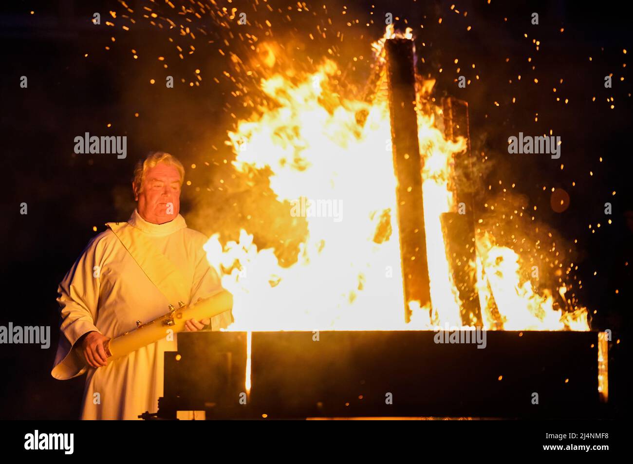 The Paschal candle is lit during a Dawn Liturgy of Easter service at Chichester Cathedral. Picture date: Sunday April 17, 2022. Stock Photo