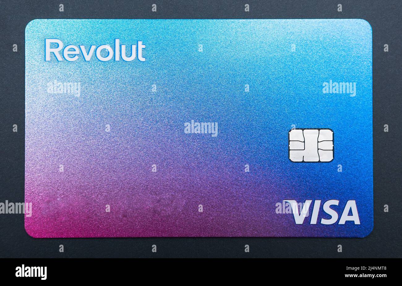 Bucharest, Romania - 03.25.2022: Close up with a Visa Revolut bank credit or debit card . Stock Photo