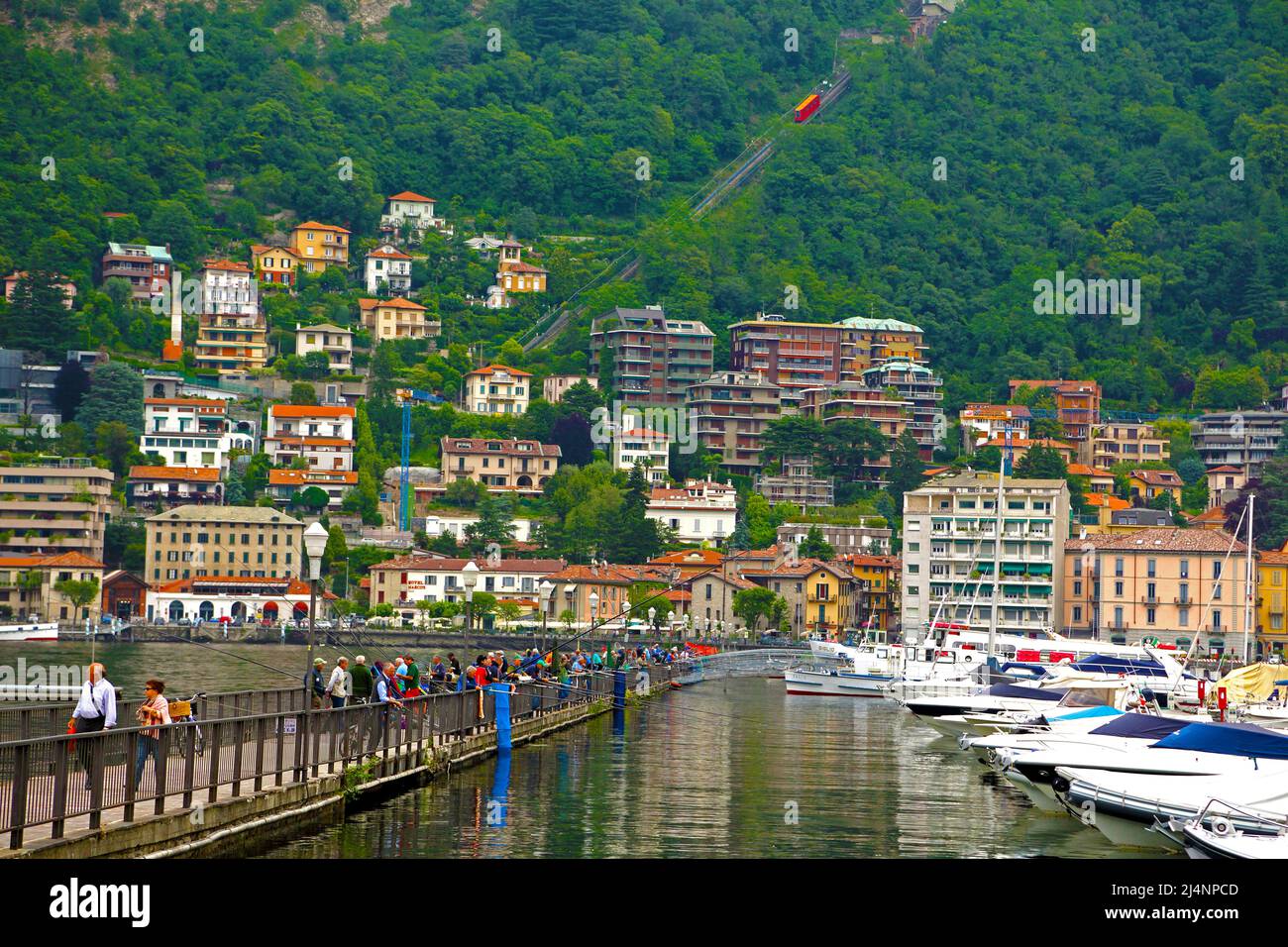 People fishing in the lake in Como in northern Italy Stock Photo