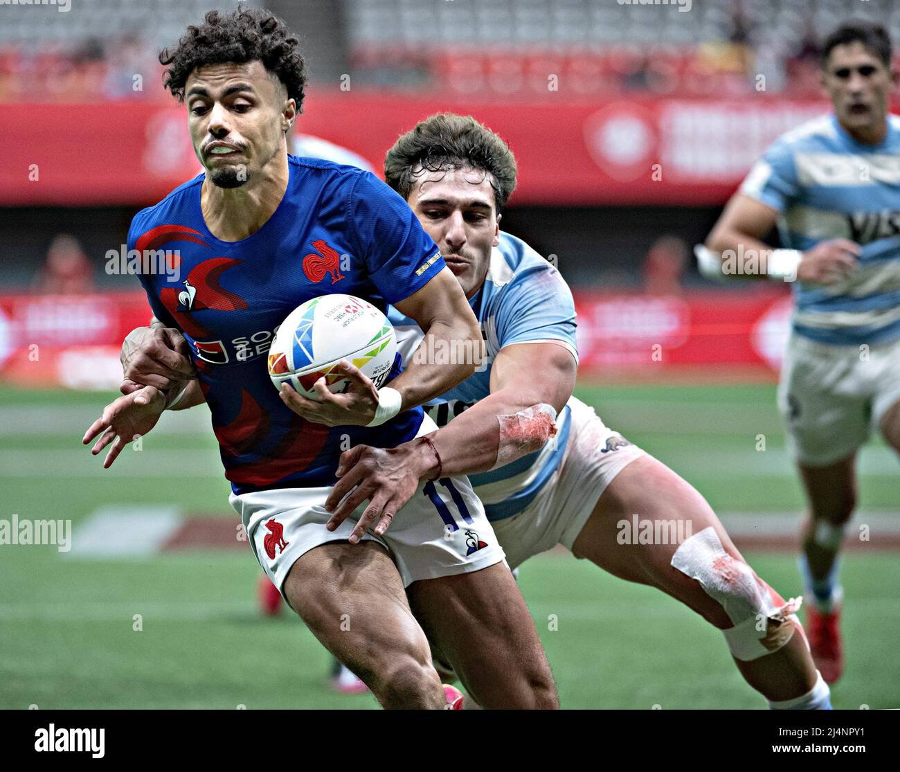 Vancouver, Canada. 16th Apr, 2022. Team France's Joachim Trouabal (L) and Team Argentina's Rodrigo Isgro compete during their Pool D match at the HSBC World Rugby Sevens in Vancouver, Canada, April 16, 2022. Credit: Andrew Soong/Xinhua/Alamy Live News Stock Photo