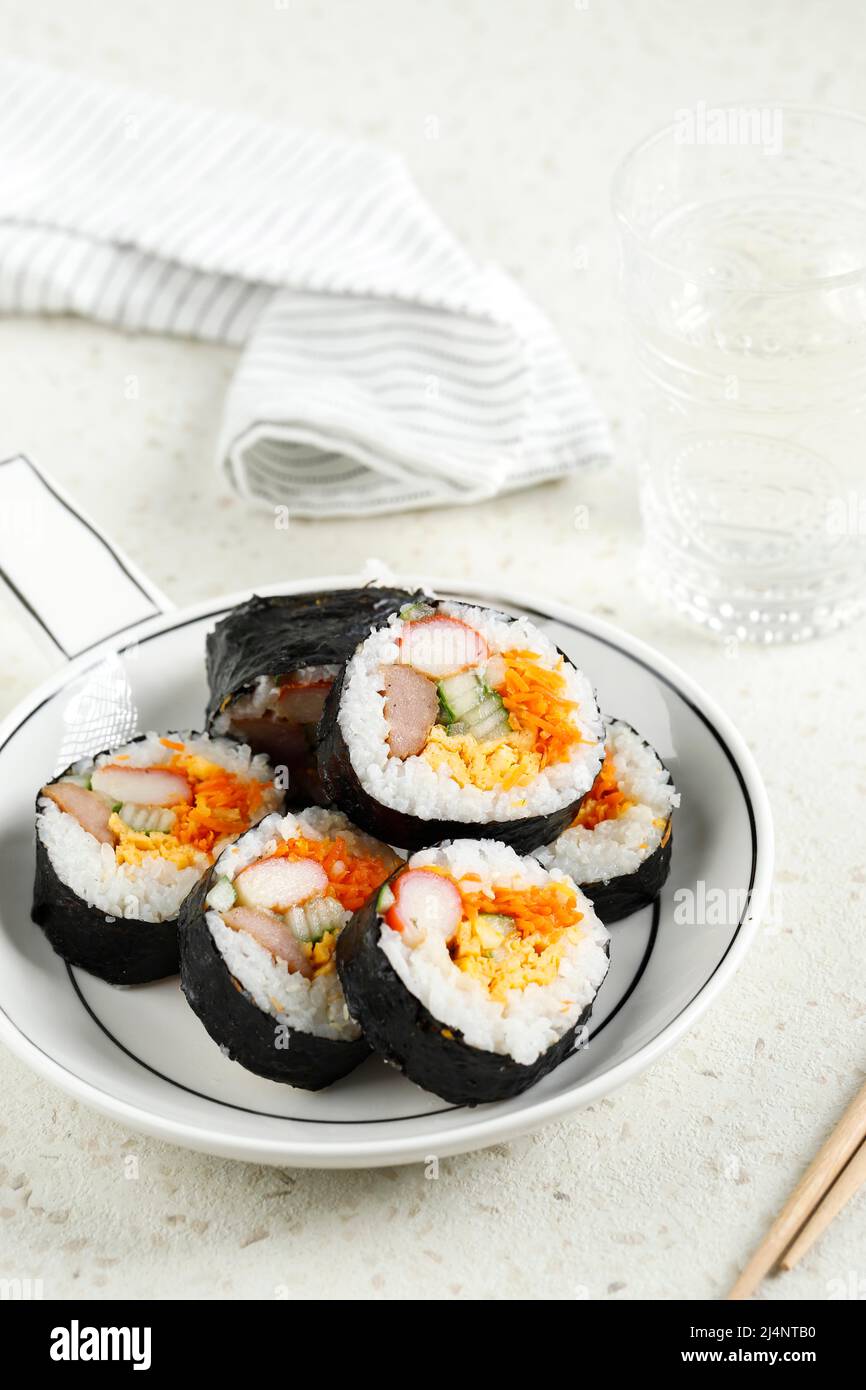 Homemade Korean Rice Roll or Kimbap with Vegetable, Egg,  Sausage, and Crabstick Stock Photo