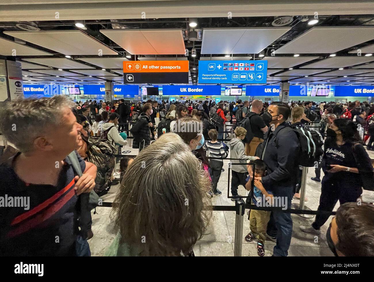 London, UK. 16th Apr, 2022. Long queues as passengers returning to the ...