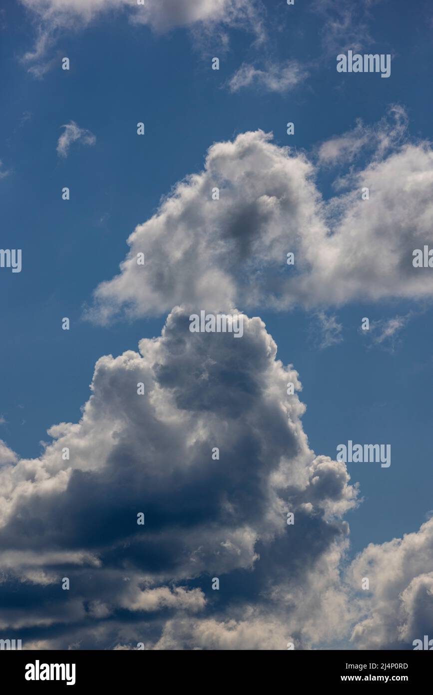 Clouds against a blue sky Stock Photo - Alamy