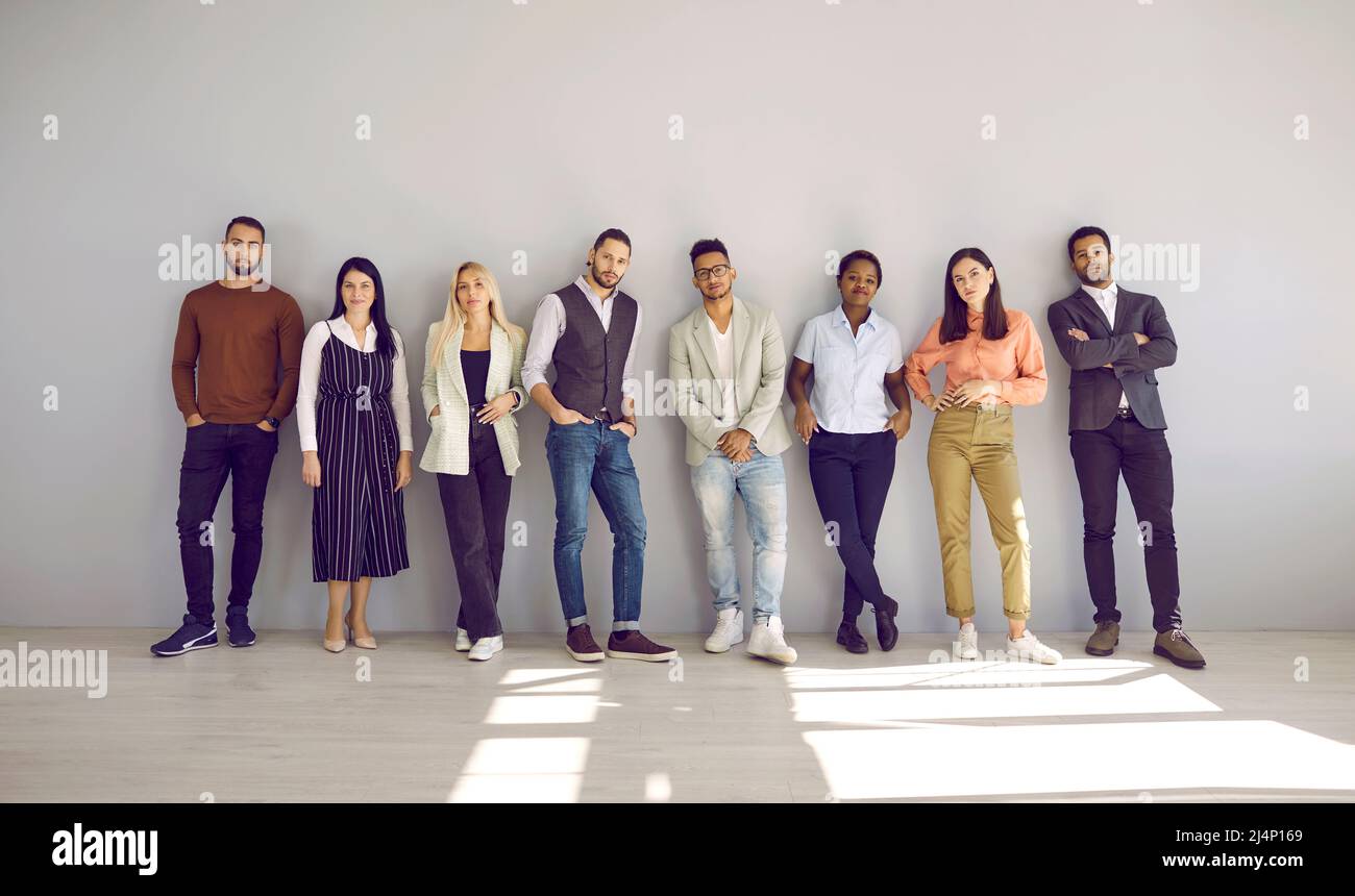 Portrait of diverse multiracial employees pose at workplace Stock Photo
