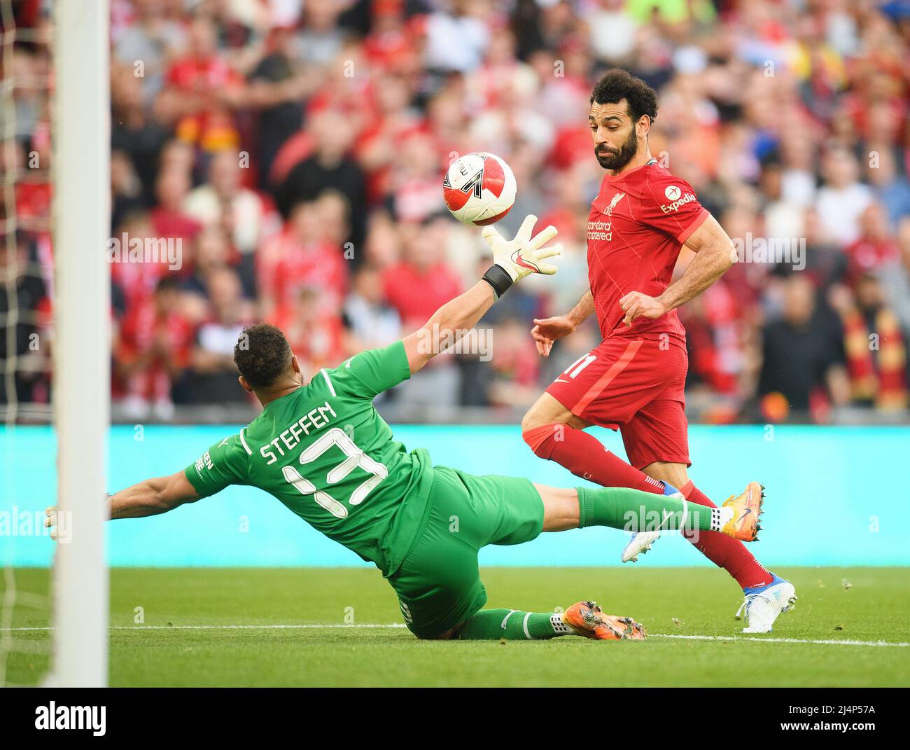 London, UK. 16 April 2022 - Manchester City v Liverpool - Emirates FA Cup - Semi Final - Wembley Stadium  Mohamed Salah chips the ball over Zack Steffen during the FA Cup Semi-Final against Manchester City Picture Credit : © Mark Pain / Alamy Live News Stock Photo