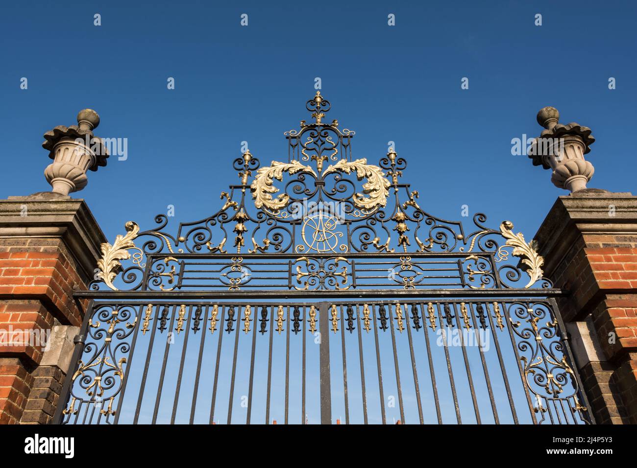 Closeup of the ornamental gates to Roehampton House, part of Queen Mary’s Place, Roehampton Lane, Roehampton, London, England, UK Stock Photo