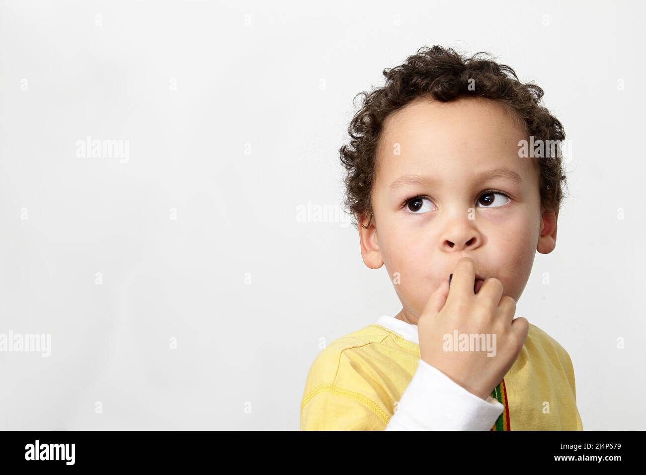 child looking to the side with background with people stock photo Stock