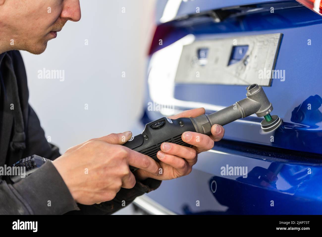 Car detailing Hand with orbital polisher in auto repair shop Stock Photo Alamy