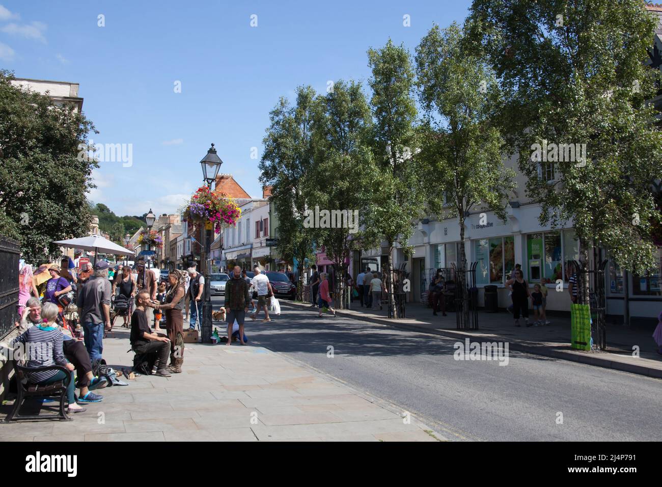 Views of people on the High Street in Glastonbury, Somerset in the UK Stock Photo
