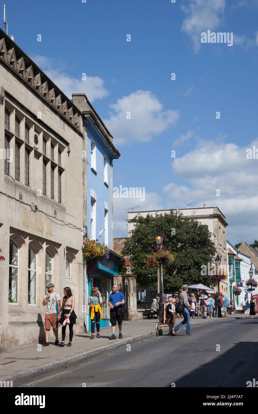 Views of people on the High Street in Glastonbury, Somerset in the UK Stock Photo