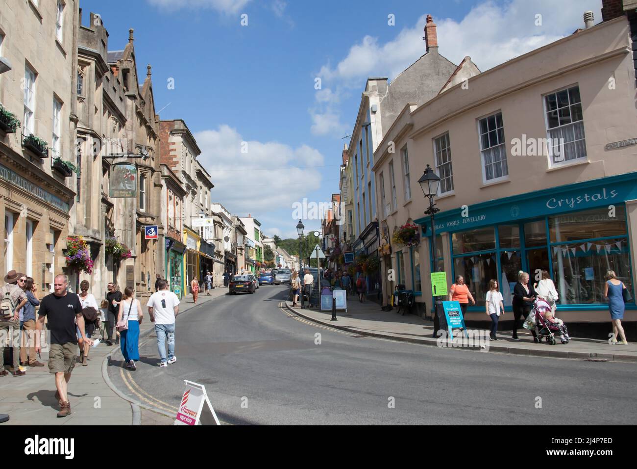 Views of shoppers on the High Street in Glastonbury, Somerset in the UK Stock Photo